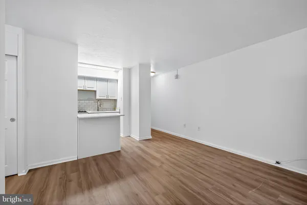 a view of a kitchen with wooden floor