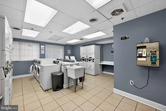 a kitchen with a sink cabinets and window