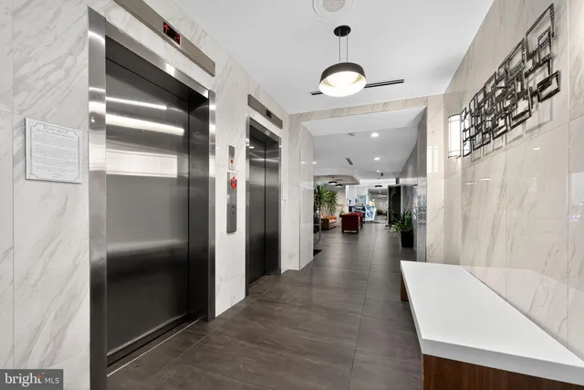 a view of a hallway with living room