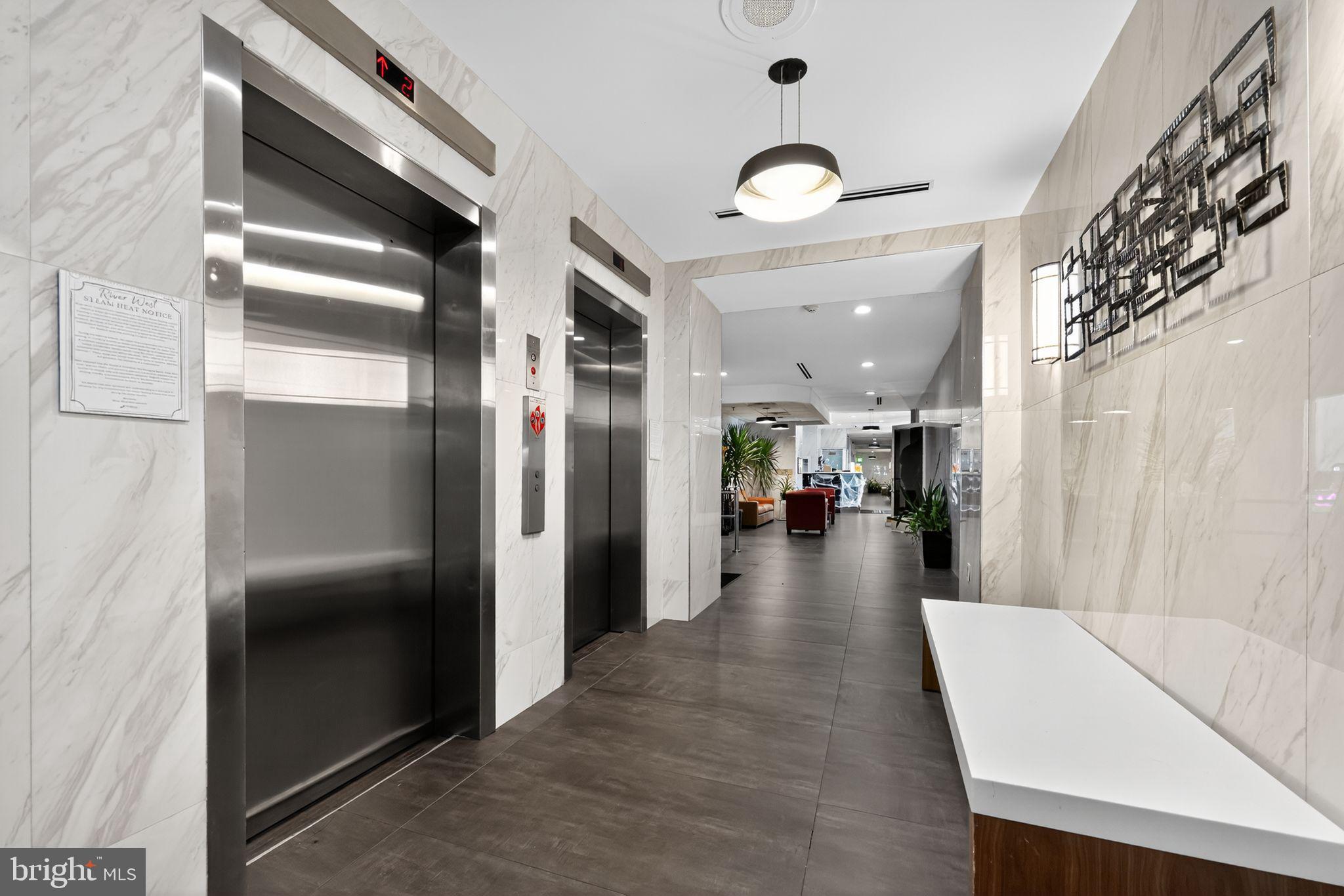 2101-17 Chestnut Street, Unit 1121 Philadelphia, PA 19103 - Photo 4 of 42 a view of a hallway with living room