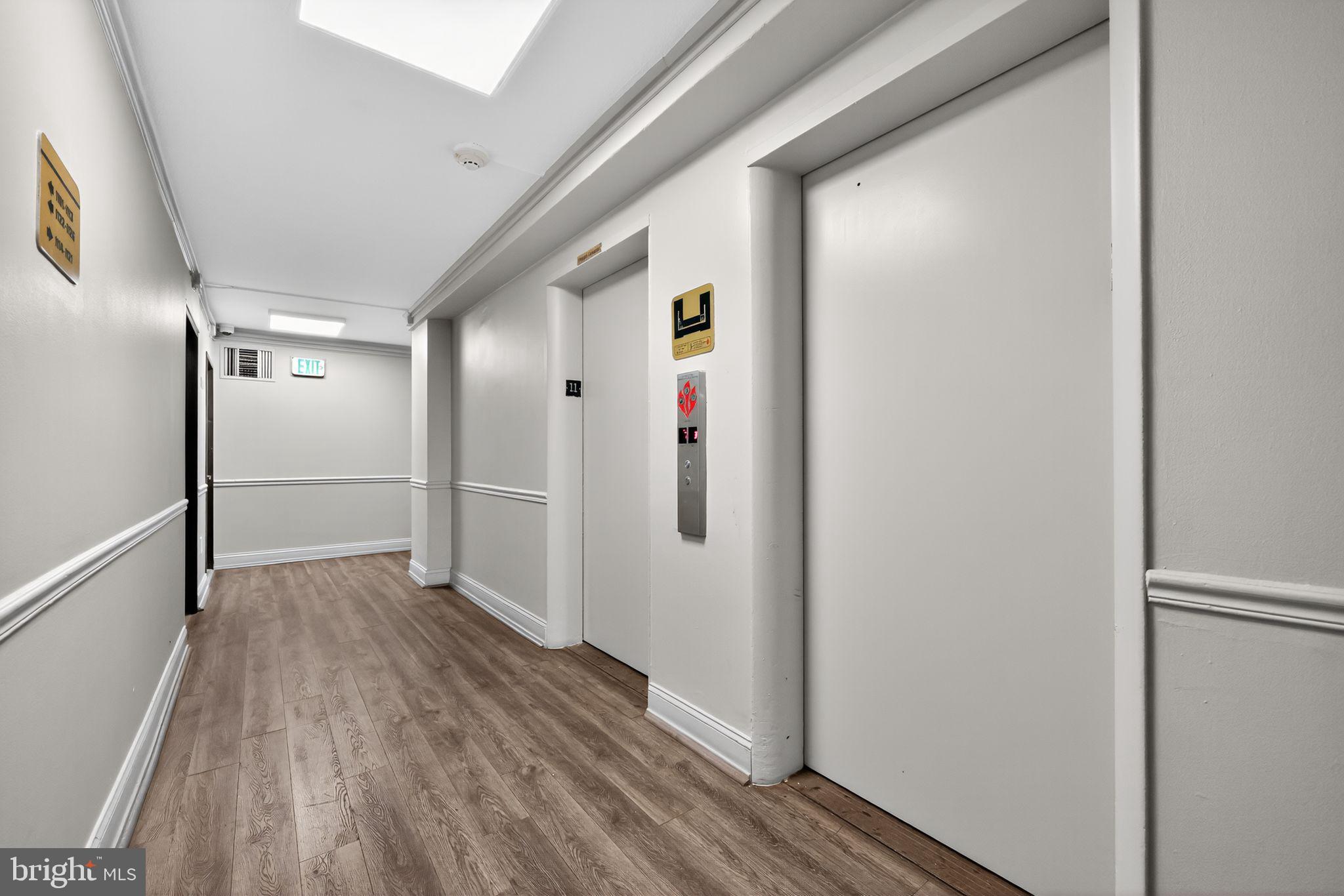 2101-17 Chestnut Street, Unit 1121 Philadelphia, PA 19103 - Photo 6 of 42 a view of hallway with wooden floor