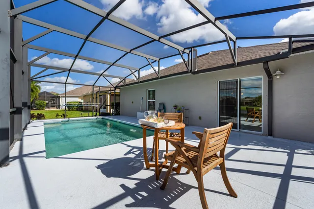a patio with table and chairs