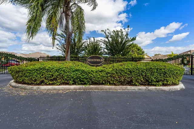 a view of a garden with a house