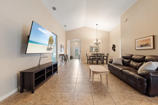 a living room with furniture and a table