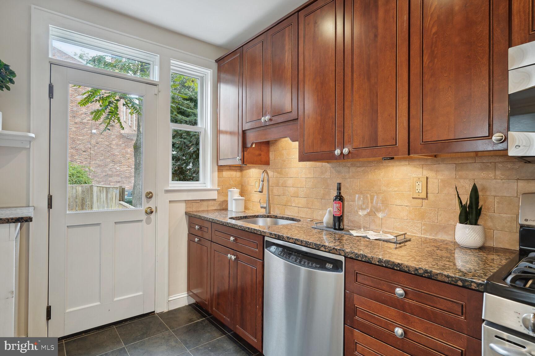 2459 Tunlaw Road Northwest Washington, DC 20007 - Photo 16 of 50 Kitchen with access to back patio