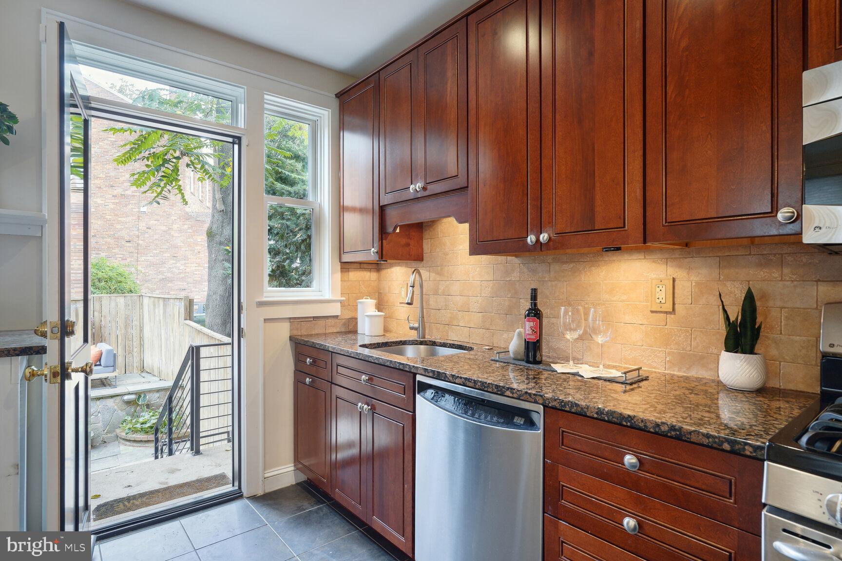 2459 Tunlaw Road Northwest Washington, DC 20007 - Photo 17 of 50 Kitchen with access to back patio