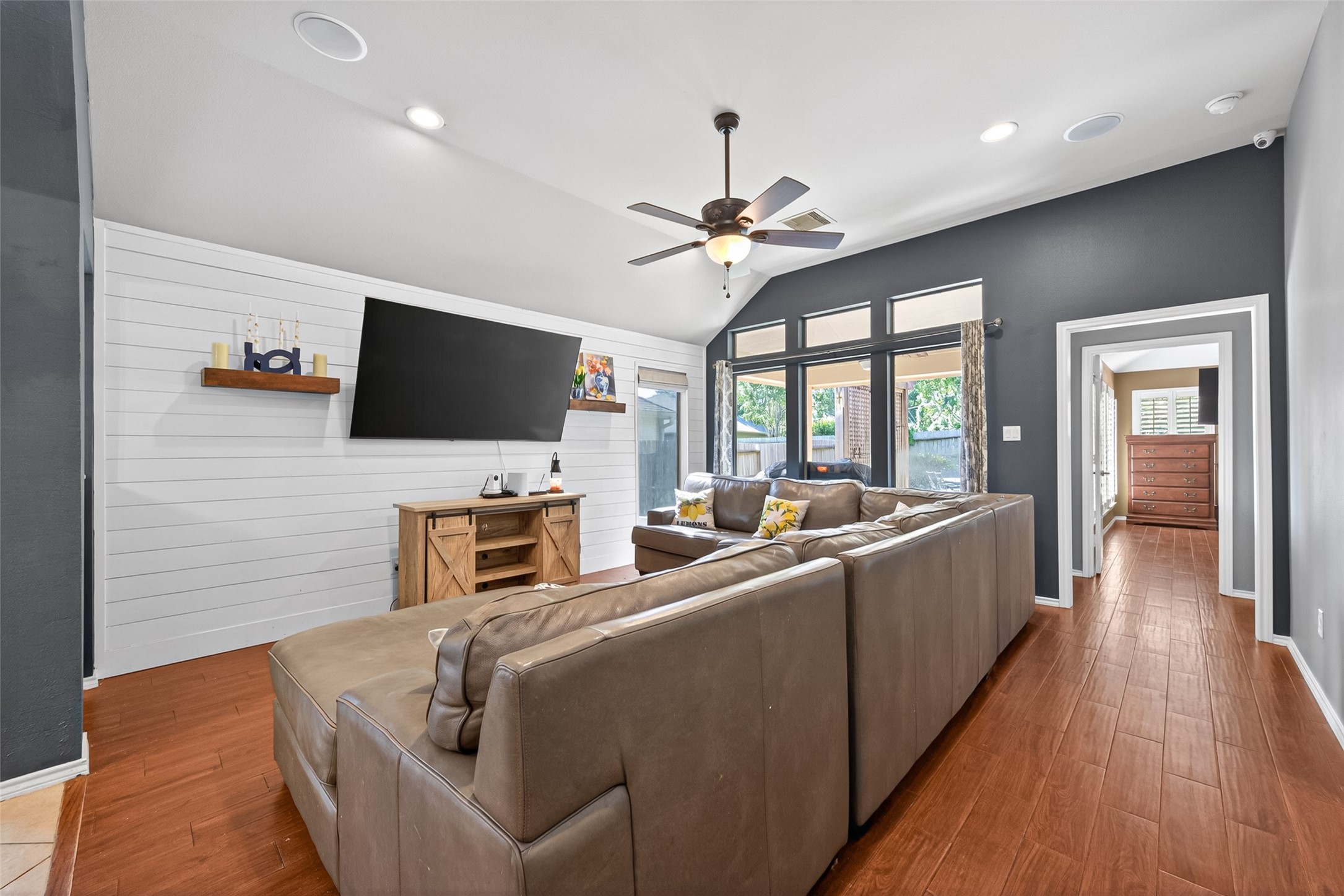 27443 Rebecca Field Lane Spring, TX 77386 - Photo 14 of 31 This inviting living room features shiplap accent wall, and large windows that let in ample natural light.