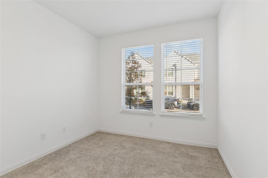 4703 Kindred Street Haltom City, TX 76117 - Photo 4 of 23 an empty room with a window