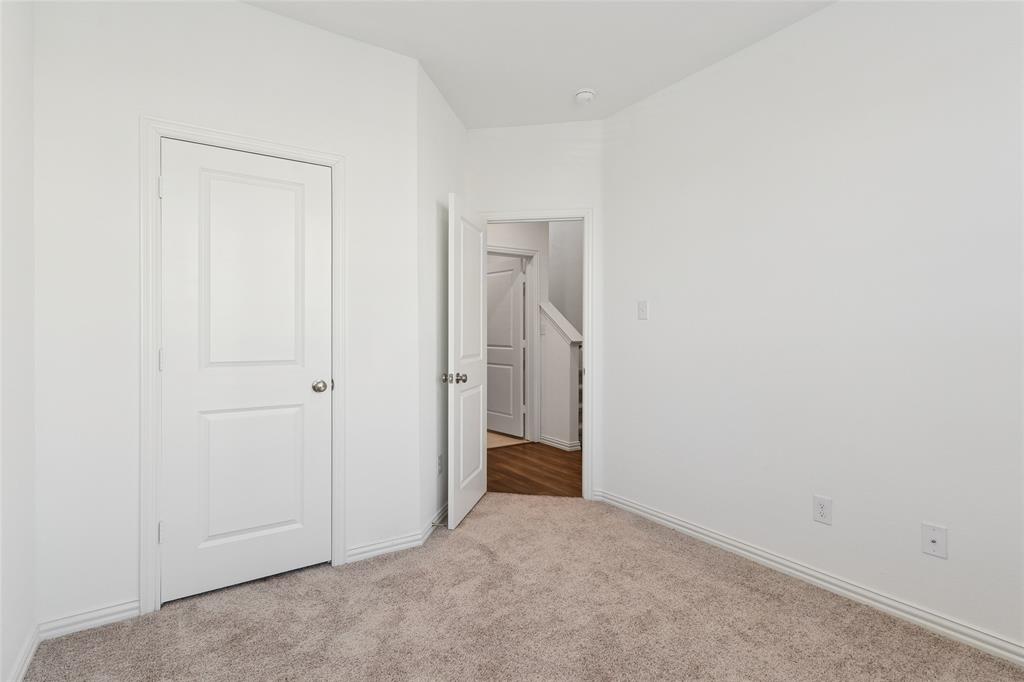 4703 Kindred Street Haltom City, TX 76117 - Photo 5 of 23 a view of an empty room