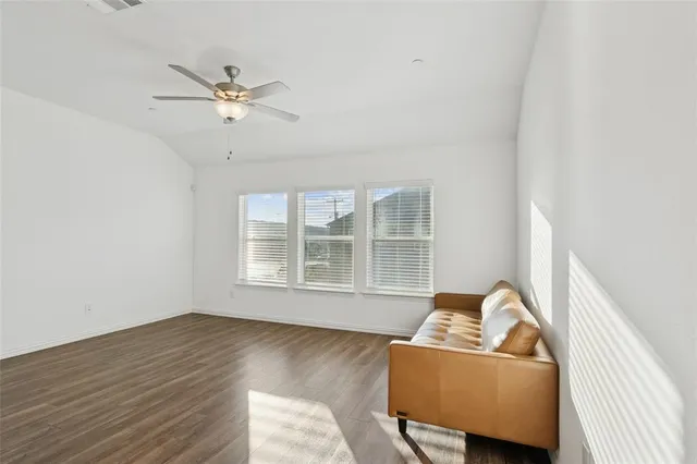 a living room with furniture and window