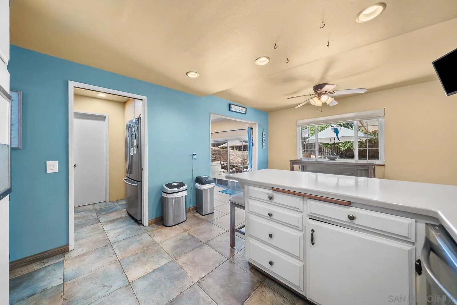 2327 Morro Road Fallbrook, CA 92028 - Photo 12 of 75 a kitchen with a sink and dishwasher a refrigerator with white cabinets