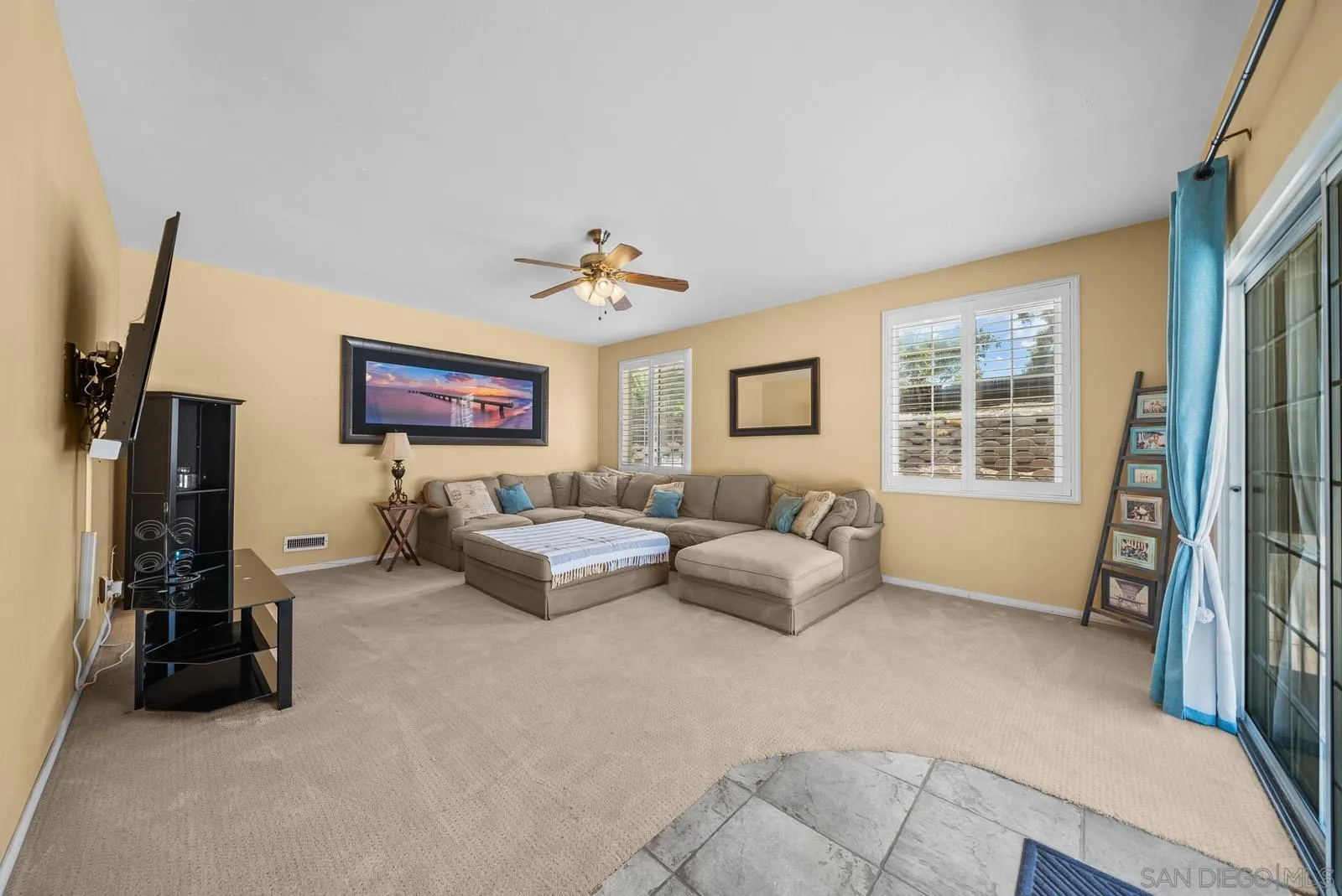 2327 Morro Road Fallbrook, CA 92028 - Photo 19 of 75 a living room with furniture and a flat screen tv
