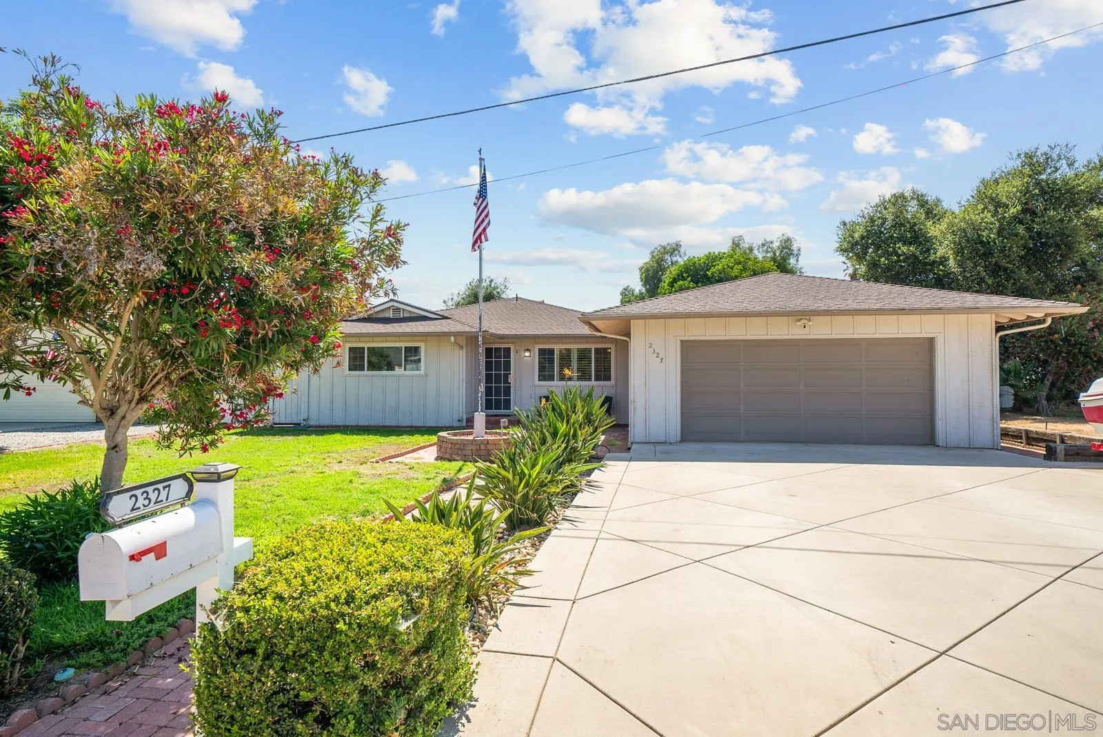 2327 Morro Road Fallbrook, CA 92028 - Photo 2 of 75 a front view of a house with garden