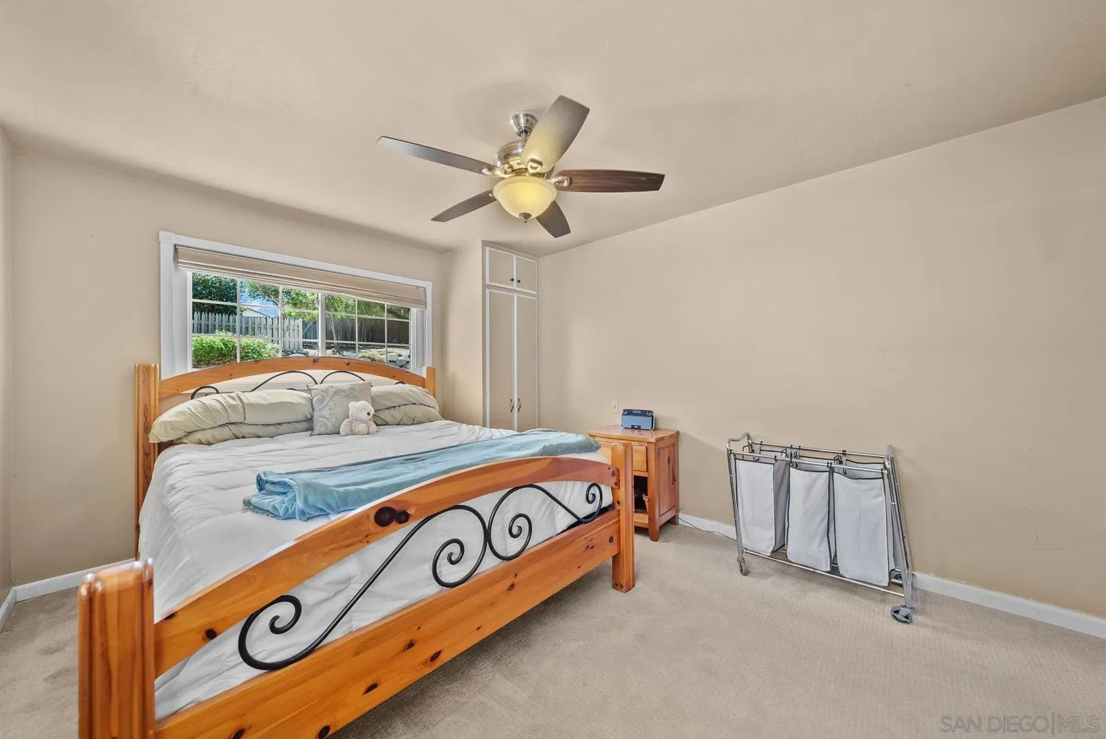 2327 Morro Road Fallbrook, CA 92028 - Photo 27 of 75 a bedroom with a bed and a chandelier