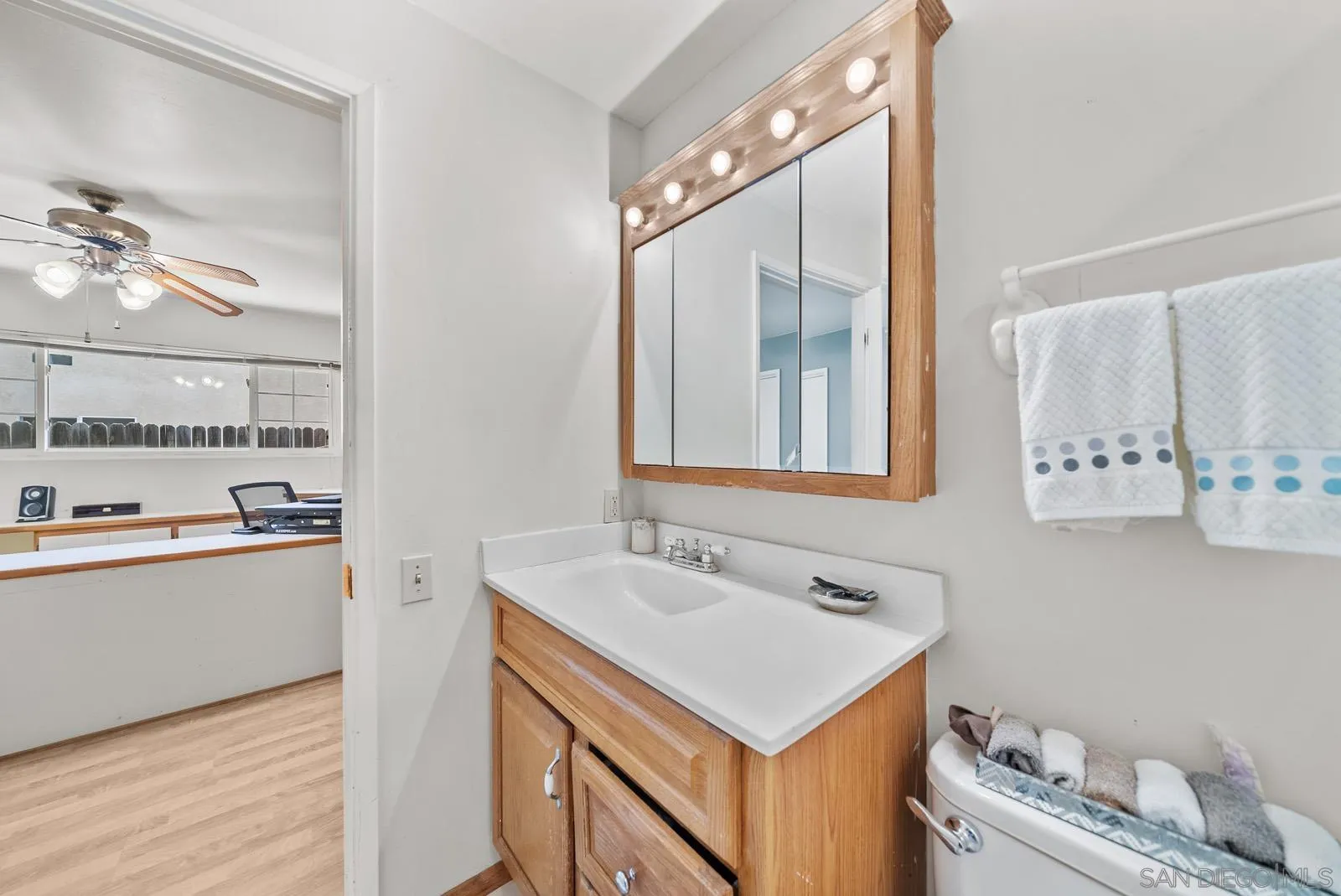 2327 Morro Road Fallbrook, CA 92028 - Photo 31 of 75 a bathroom with a sink vanity and mirror