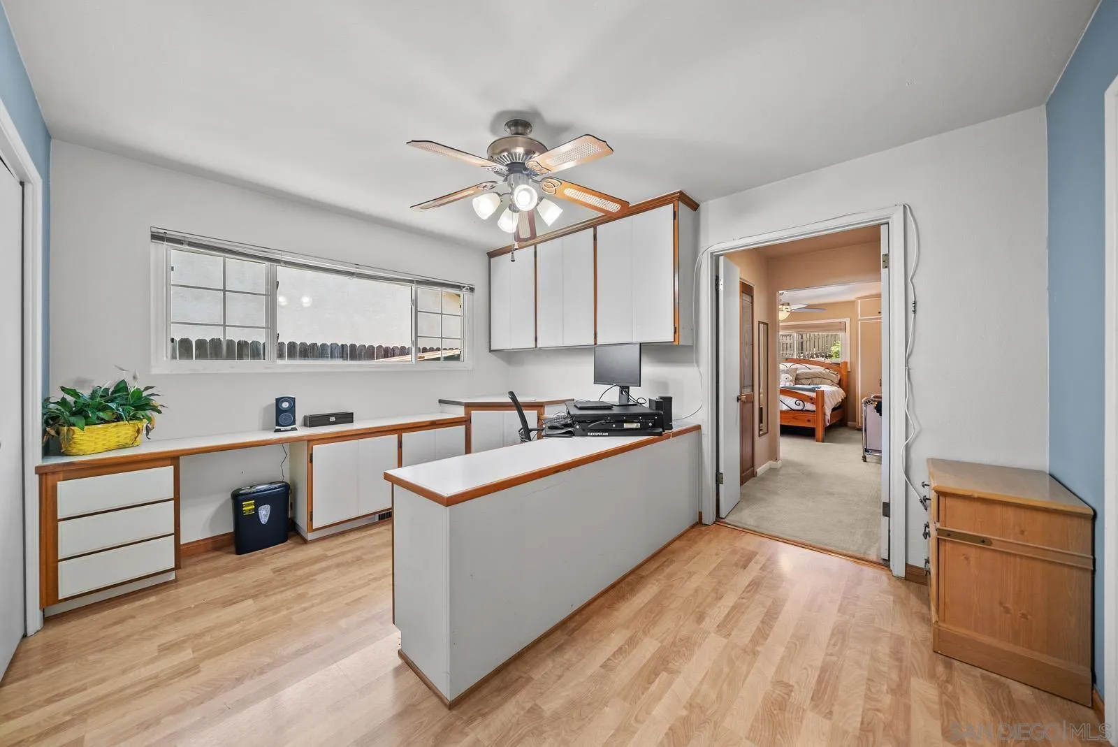 2327 Morro Road Fallbrook, CA 92028 - Photo 32 of 75 a large kitchen with kitchen island a large counter space a sink appliances and cabinets