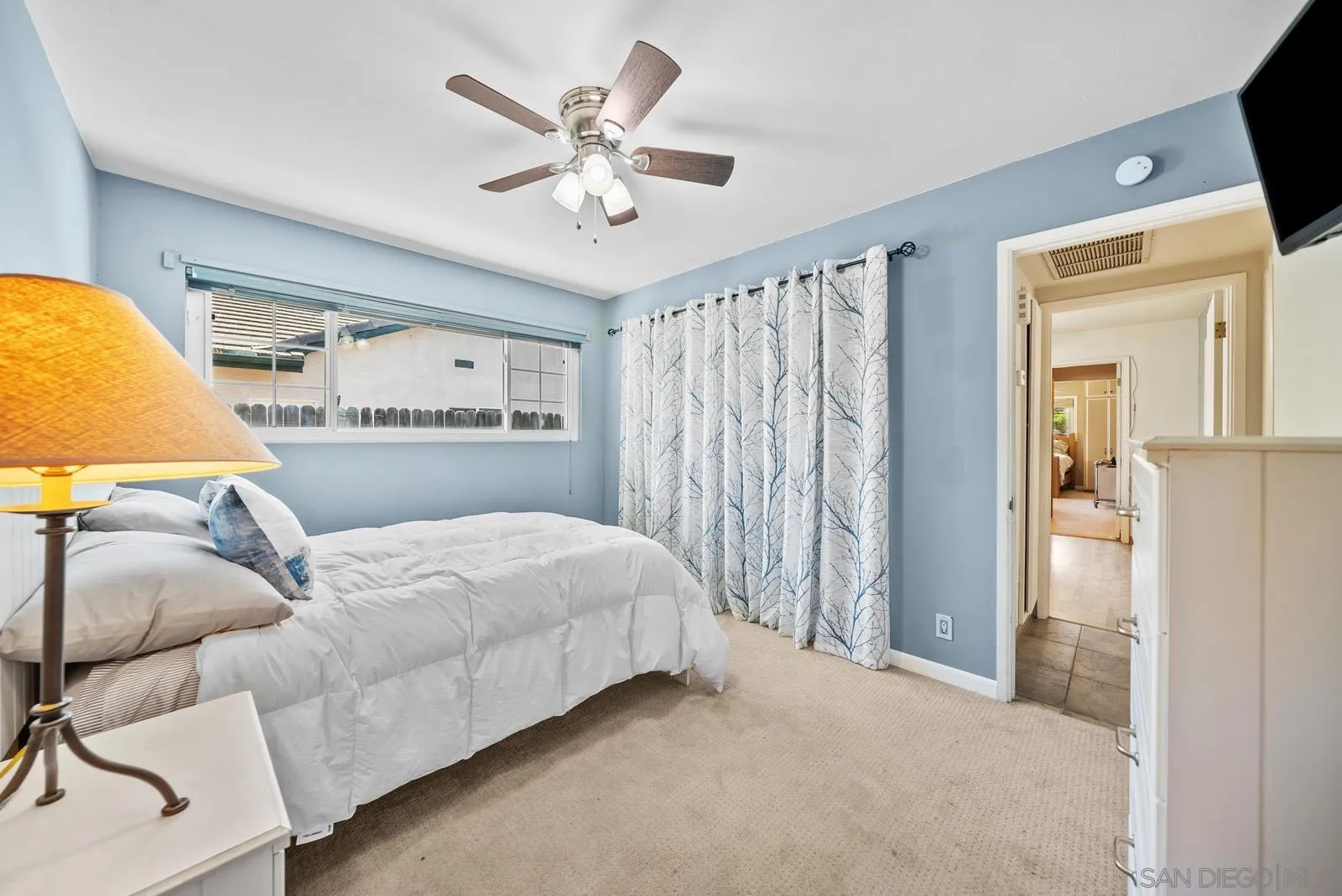 2327 Morro Road Fallbrook, CA 92028 - Photo 36 of 75 a bedroom with a bed and a chandelier