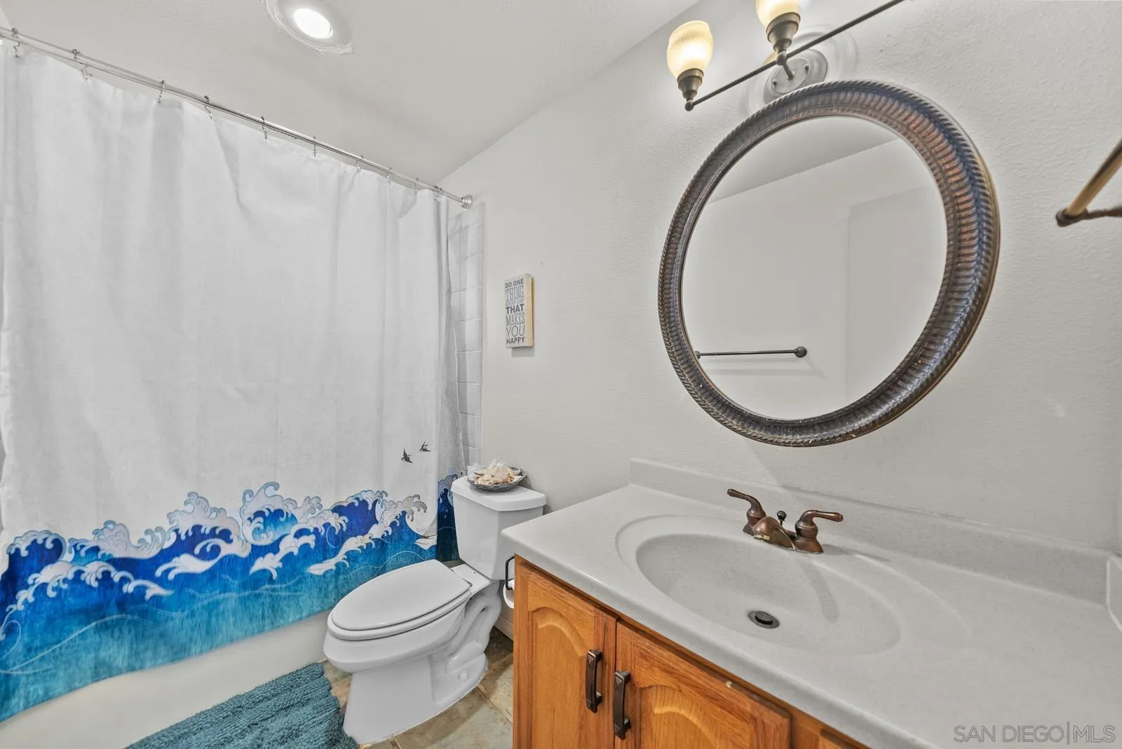 2327 Morro Road Fallbrook, CA 92028 - Photo 39 of 75 a bathroom with a sink mirror and toilet