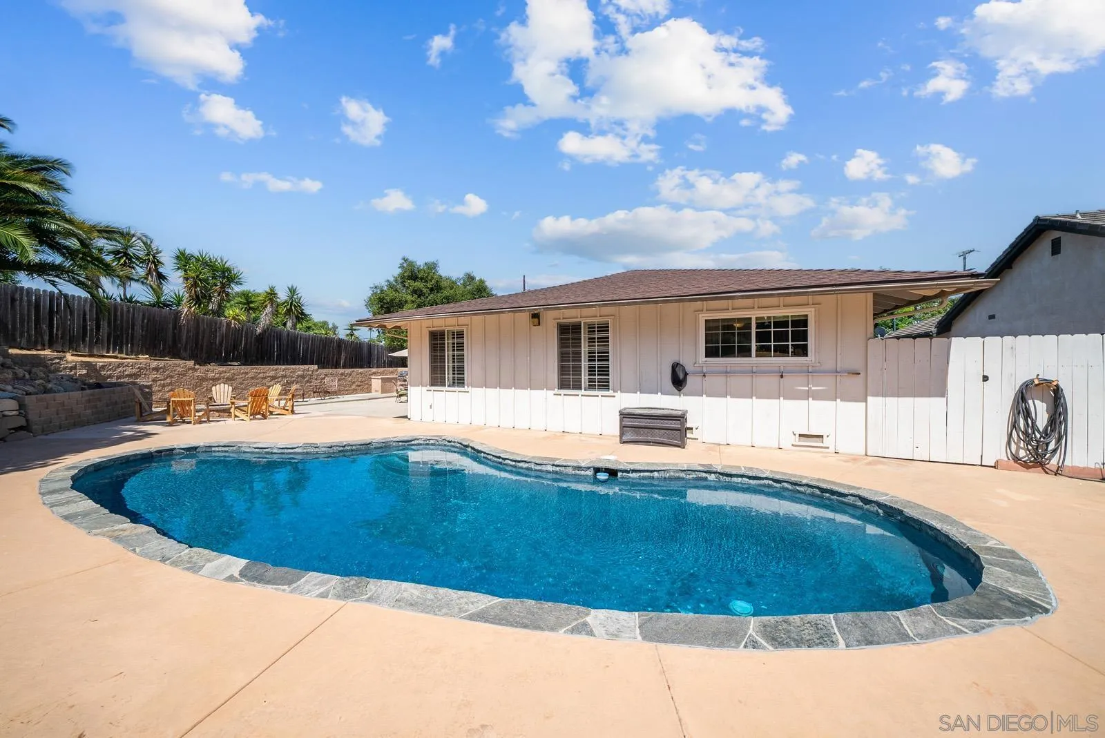 2327 Morro Road Fallbrook, CA 92028 - Photo 48 of 75 a view of a house with swimming pool and a yard