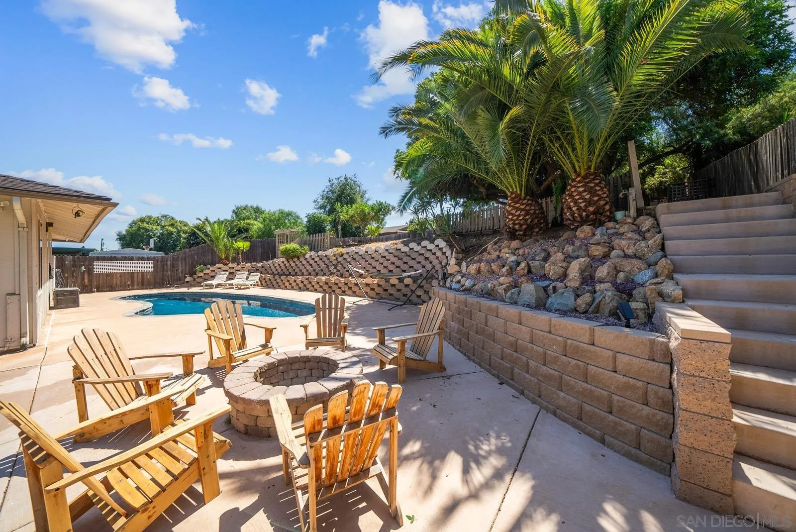 2327 Morro Road Fallbrook, CA 92028 - Photo 51 of 75 a view of a patio with couches table and chairs and potted plants