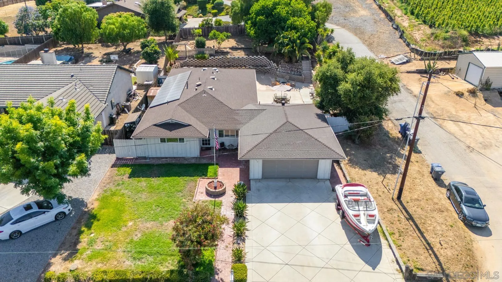2327 Morro Road Fallbrook, CA 92028 - Photo 62 of 75 a aerial view of a house with swimming pool and large trees