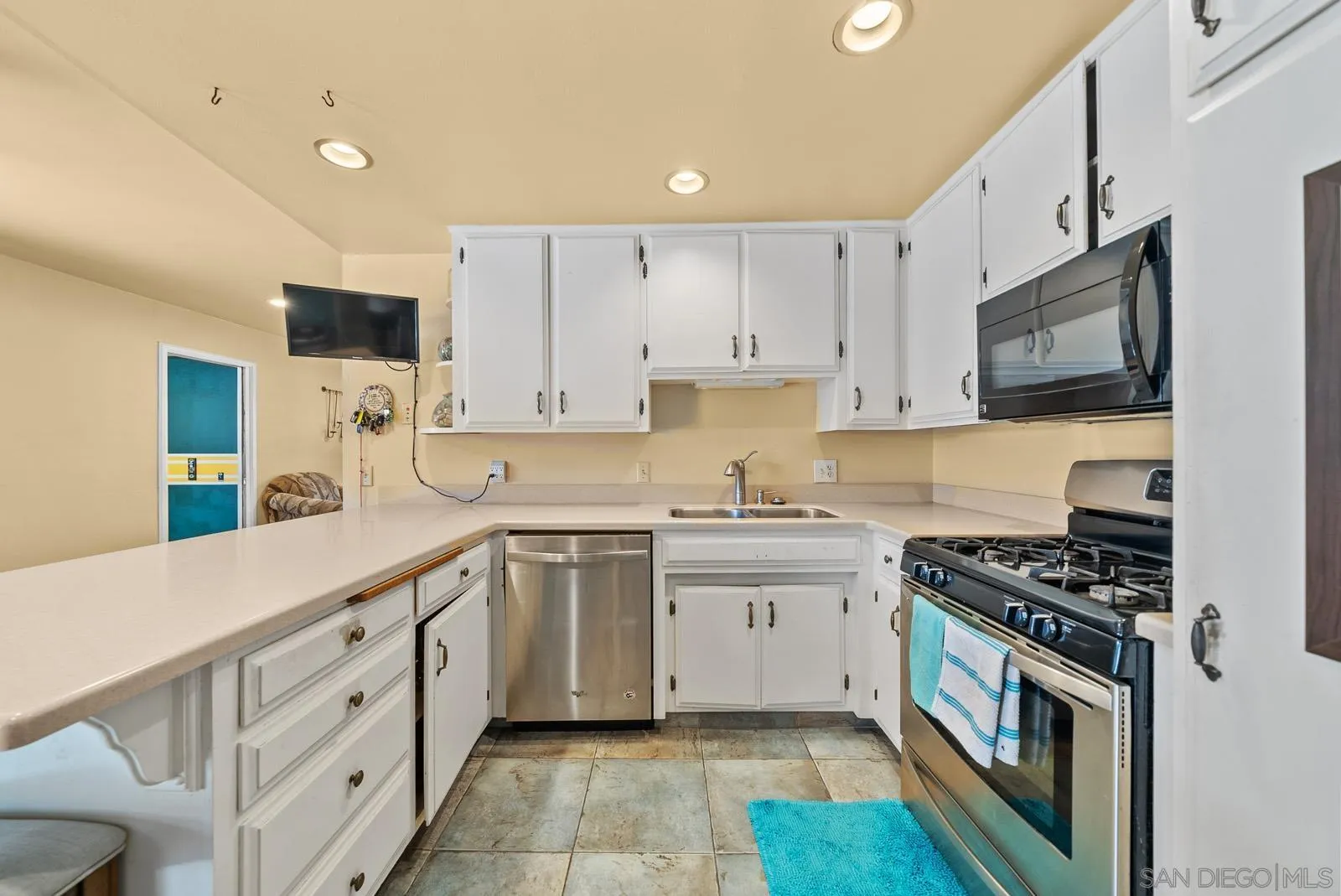 2327 Morro Road Fallbrook, CA 92028 - Photo 10 of 75 a kitchen with cabinets stainless steel appliances and a sink