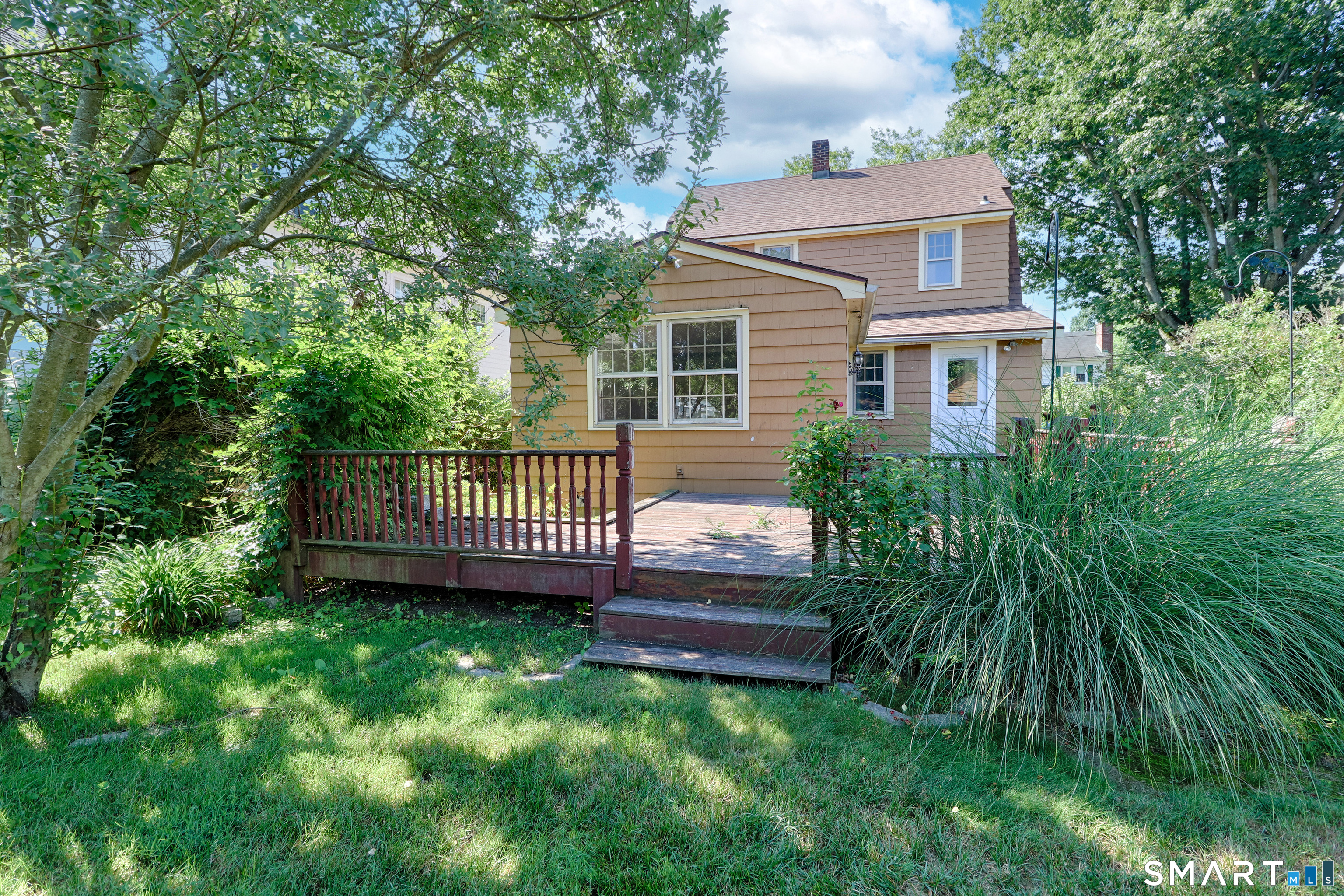 104 Henderson Road Fairfield, CT 06824 - Photo 25 of 26 This is the view of the deck from the backyard.
