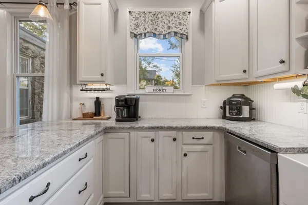 a bathroom with a sink and a window