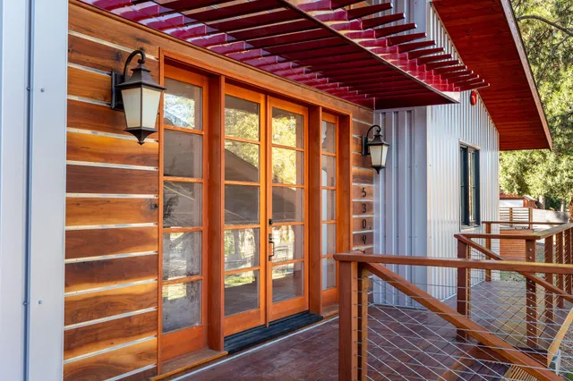 a spacious bedroom with a bed and wooden floor