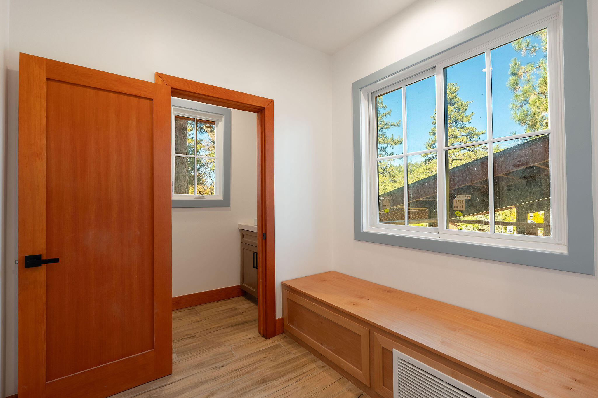 53091 Tollgate Road Idyllwild, CA 92549 - Photo 14 of 49 a room that has a window and wooden floor