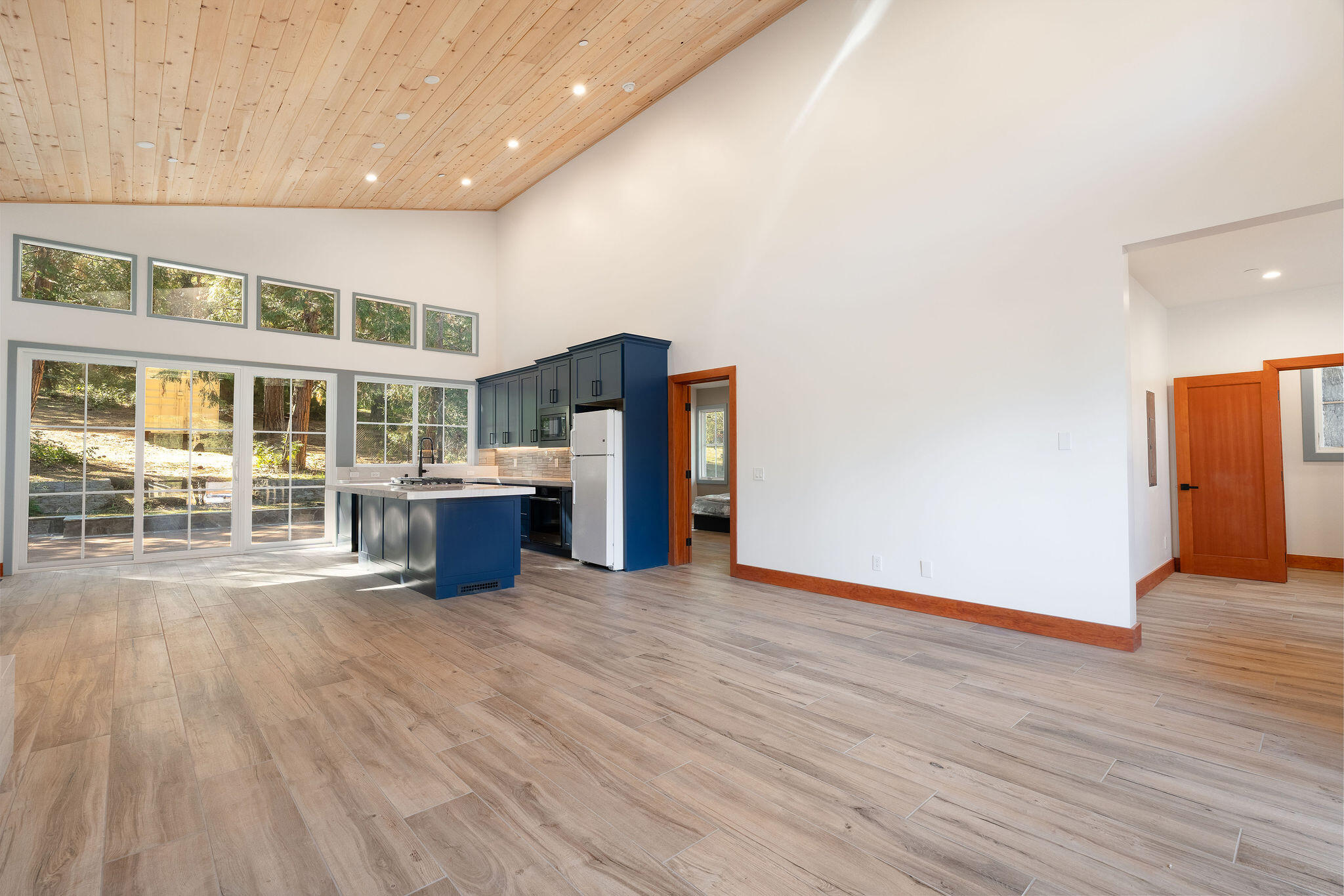53091 Tollgate Road Idyllwild, CA 92549 - Photo 17 of 49 a view of a living room with wooden floor and a large window