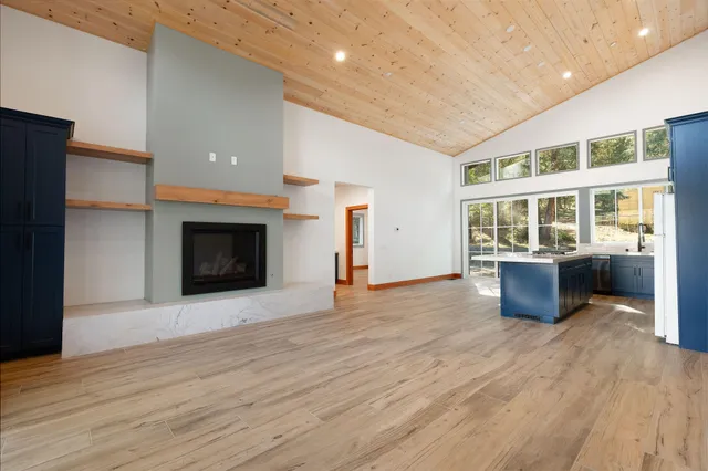 a view of a backyard with large trees