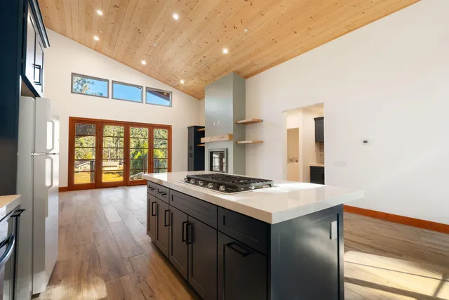 a view of a yard with large trees