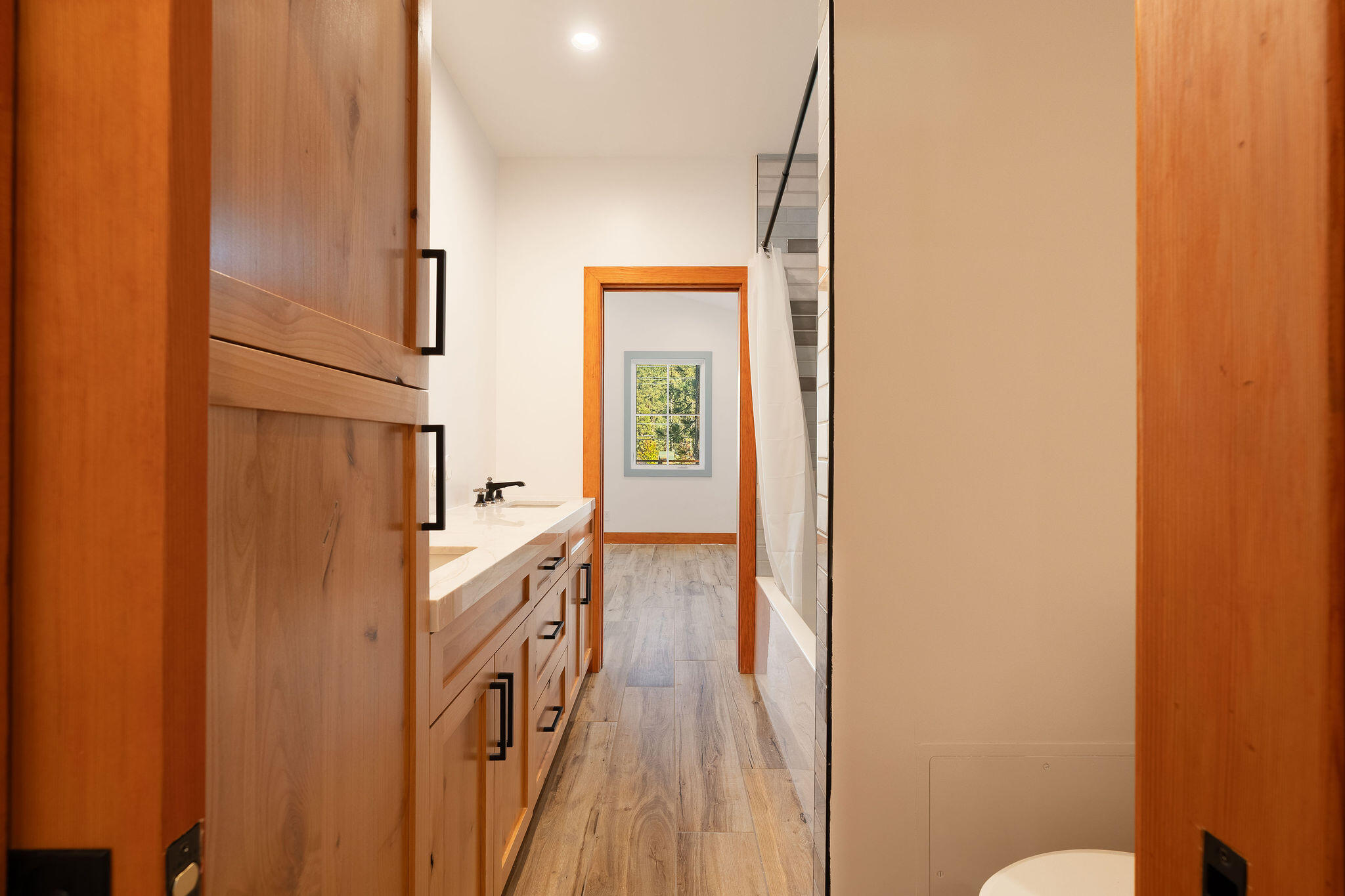 53091 Tollgate Road Idyllwild, CA 92549 - Photo 36 of 49 a bathroom with a sink a mirror and a toilet