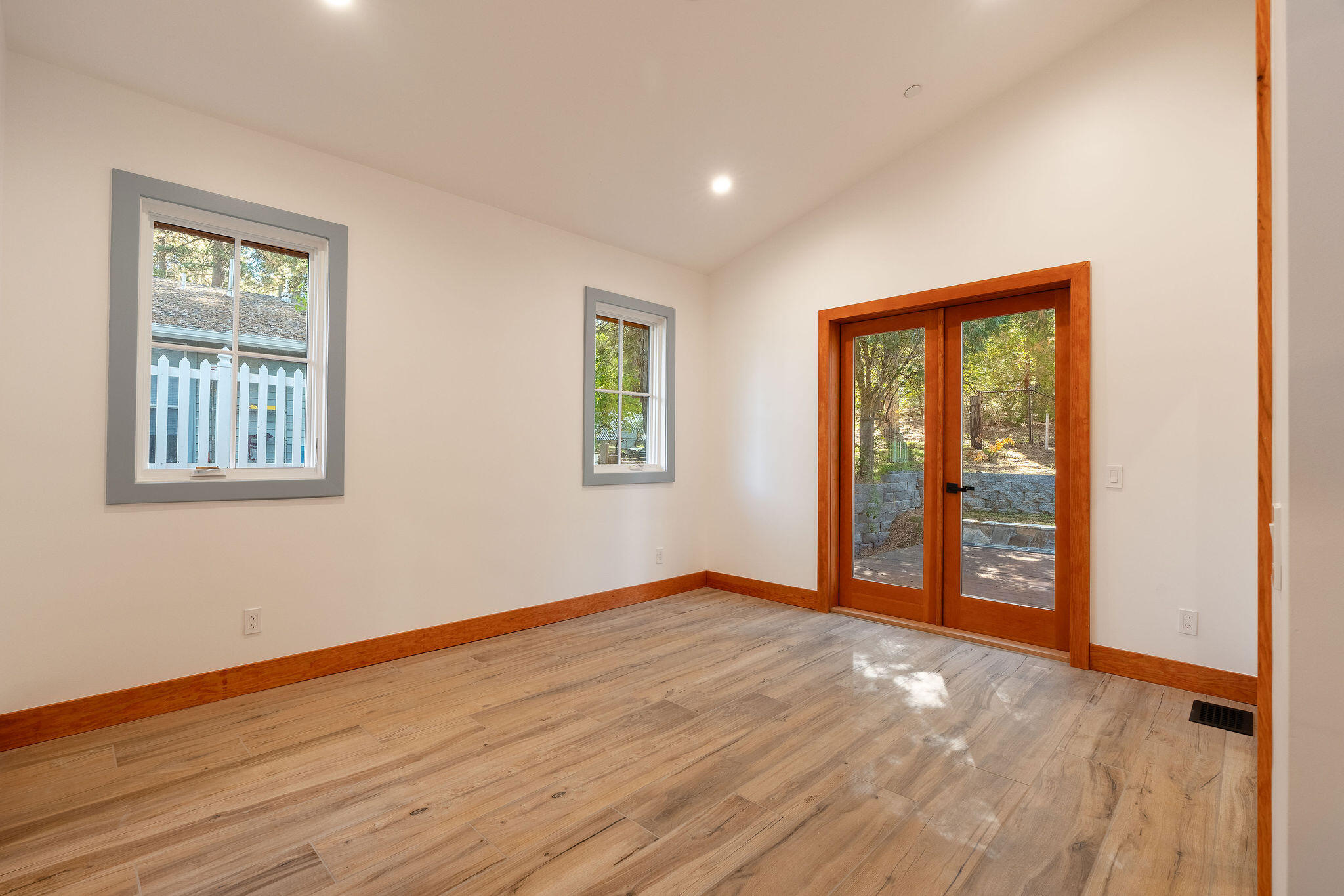 53091 Tollgate Road Idyllwild, CA 92549 - Photo 39 of 49 a view of an empty room with window and wooden floor