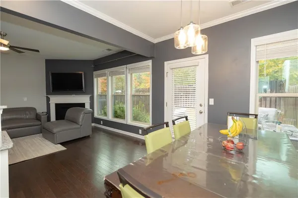 a living room with fireplace furniture and a flat screen tv