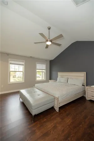 a bedroom with a bed and window