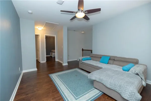 a living room with furniture and a rug