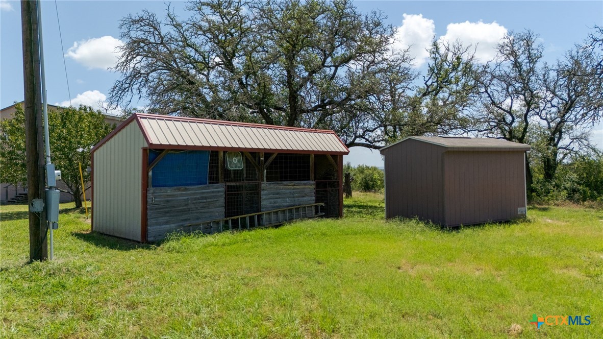 586 Private Road 3448 Kempner, TX 76539 - Photo 31 of 40 a view of a house with a yard and a wooden fence
