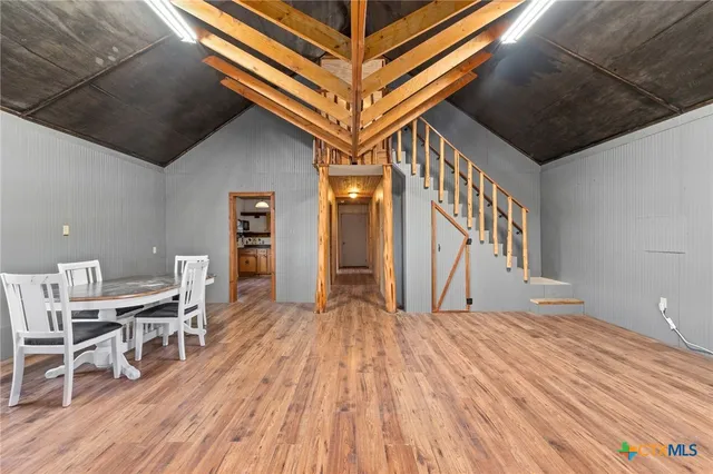 a view of a livingroom with furniture and wooden floor