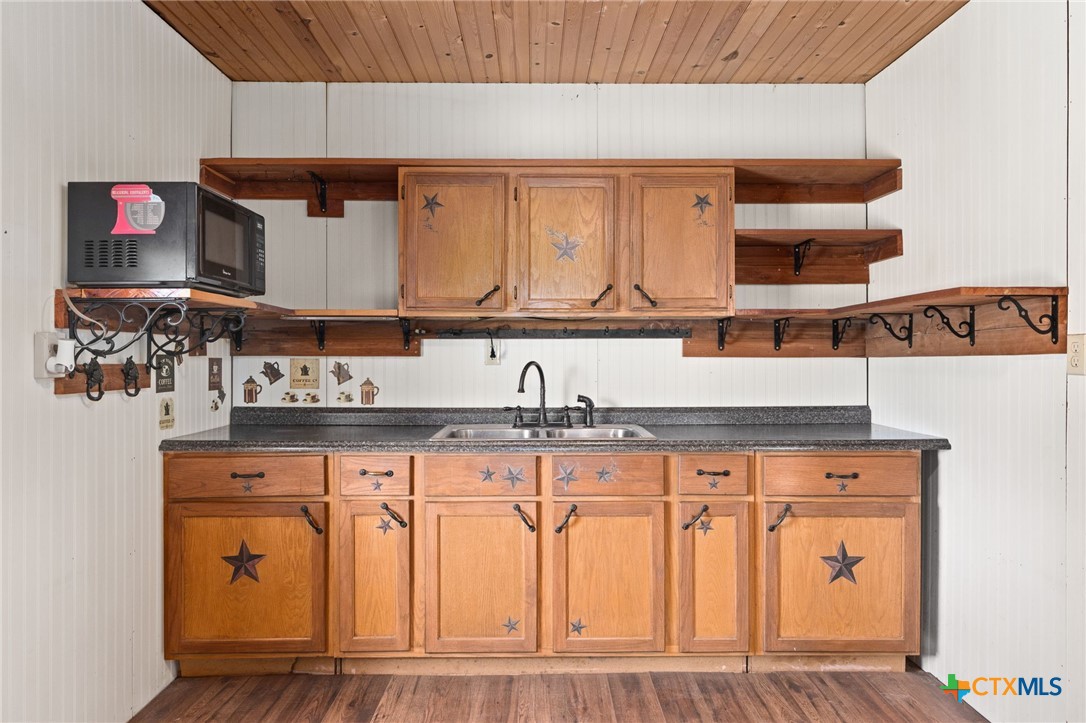586 Private Road 3448 Kempner, TX 76539 - Photo 10 of 40 a kitchen with white cabinets and sink