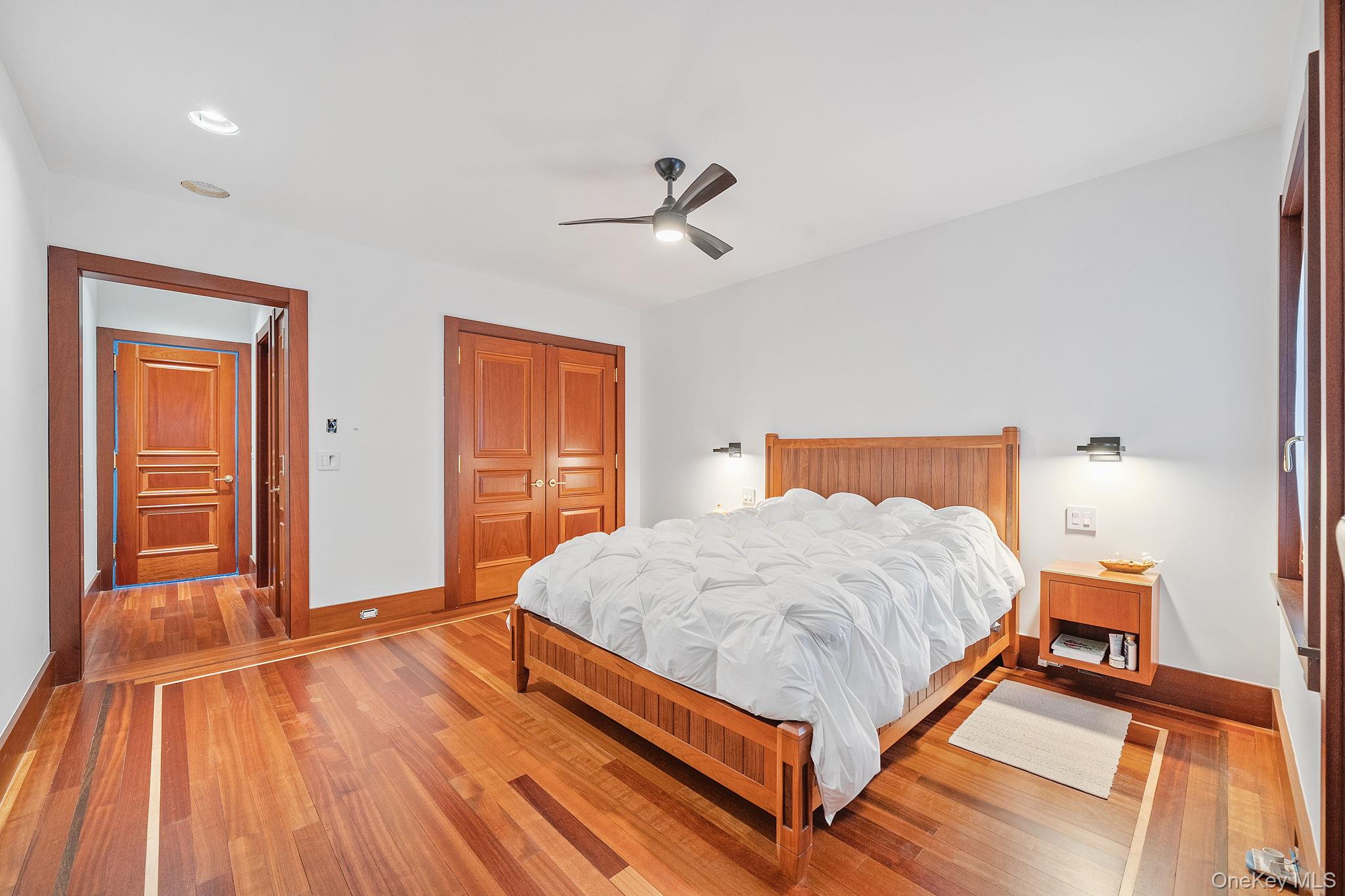 181 Walnut Street Lynbrook, NY 11563 - Photo 17 of 46 Bedroom with hardwood / wood-style flooring, a closet, and ceiling fan