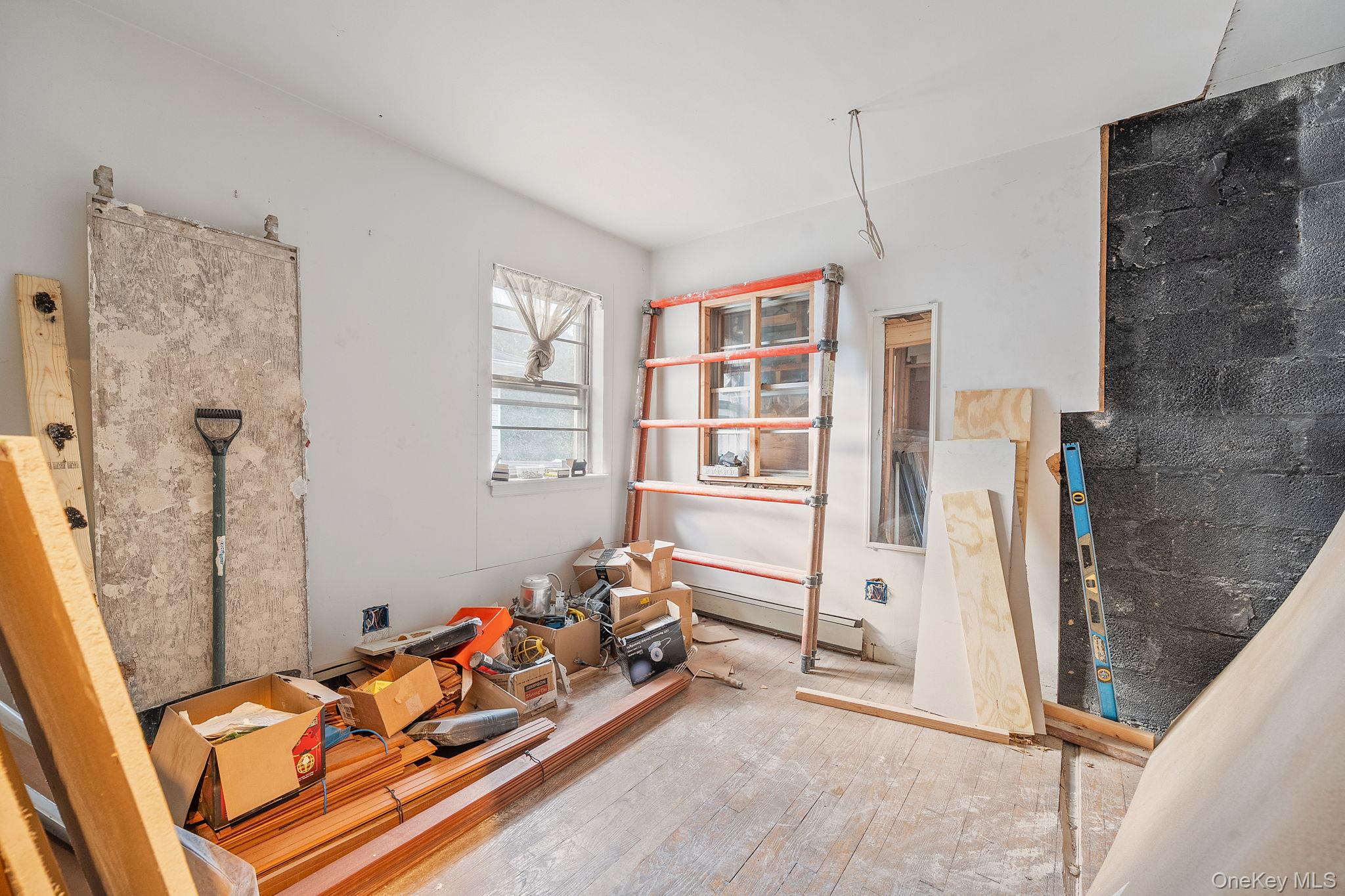 181 Walnut Street Lynbrook, NY 11563 - Photo 24 of 46 Misc room featuring wood-type flooring