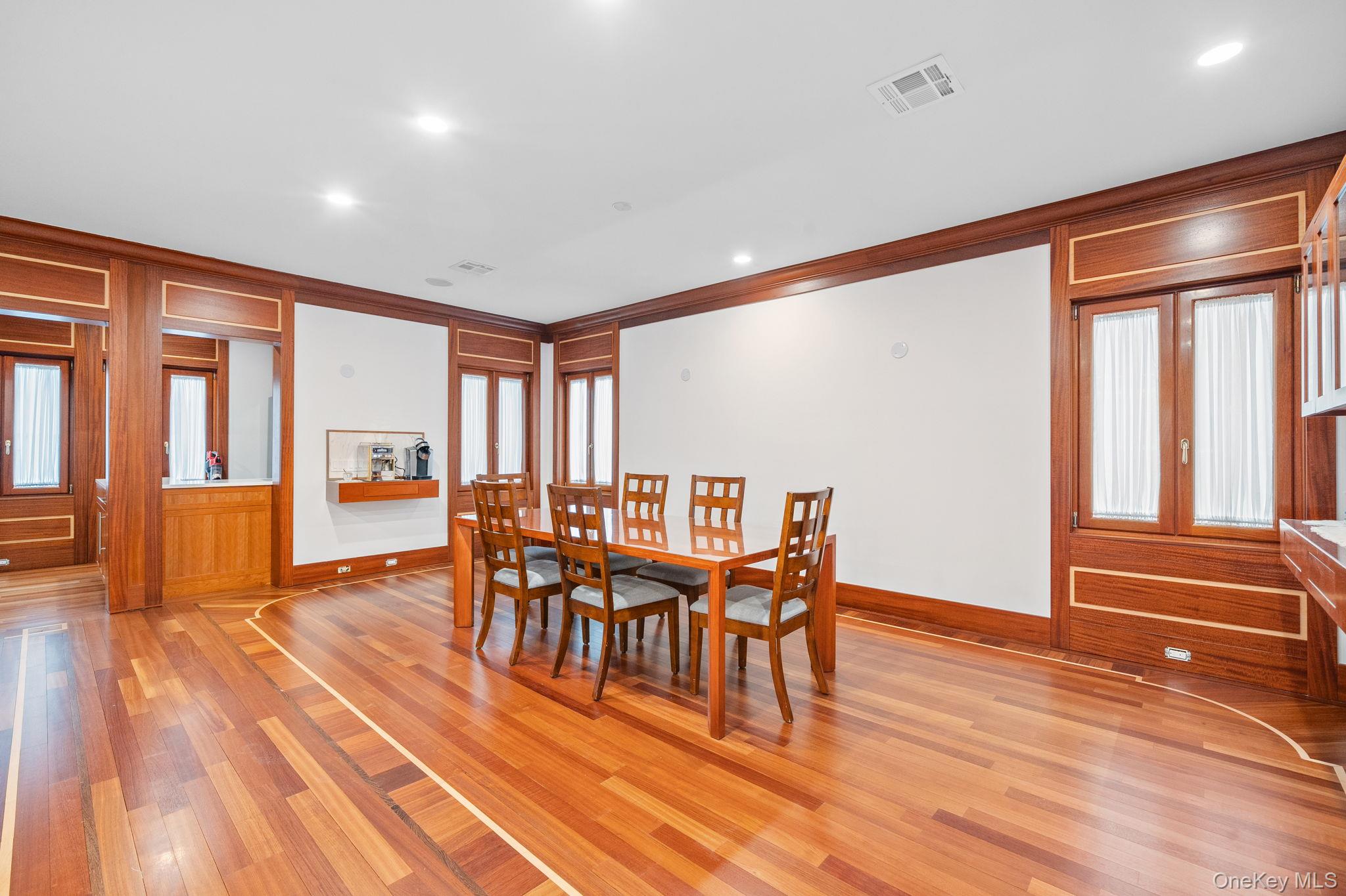181 Walnut Street Lynbrook, NY 11563 - Photo 4 of 46 Dining area featuring light wood finished floors, recessed lighting, and crown molding