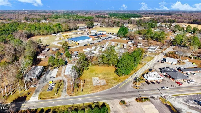 an aerial view of residential building and lake