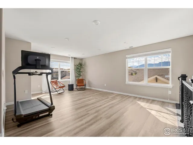 a room with gym equipment and a window