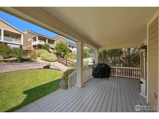 a view of a swimming pool with a yard