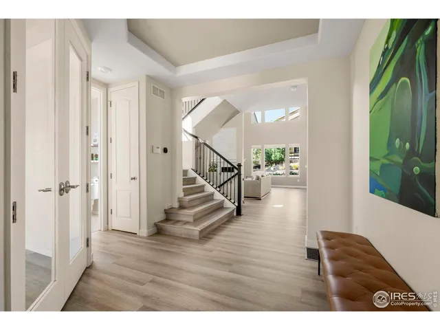 a view of entryway with wooden floor