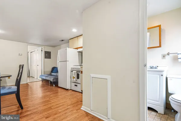 a view of kitchen with furniture and wooden floor