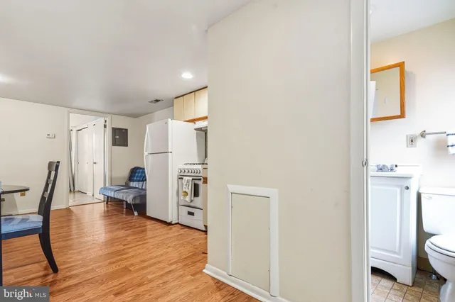 a view of kitchen with furniture and wooden floor